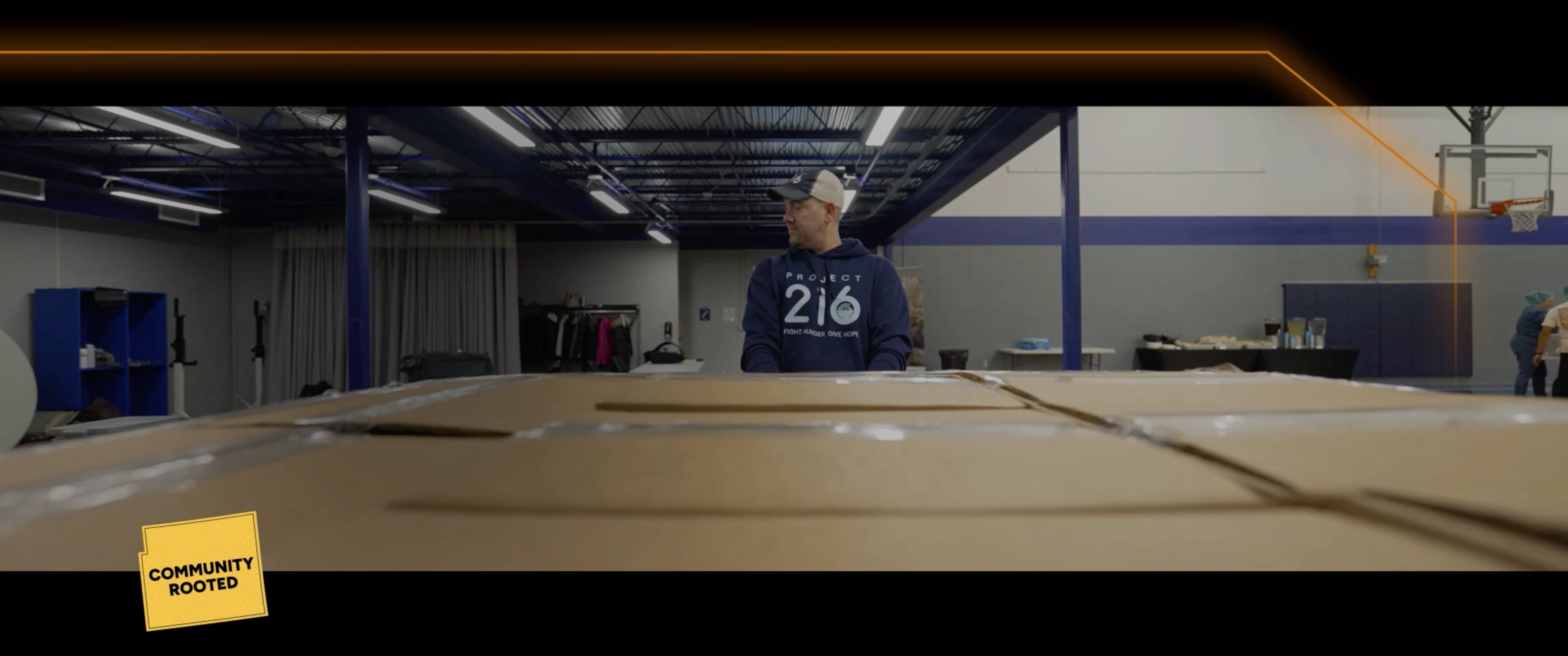 Volunteer with boxes video produced by EvMo Productions.